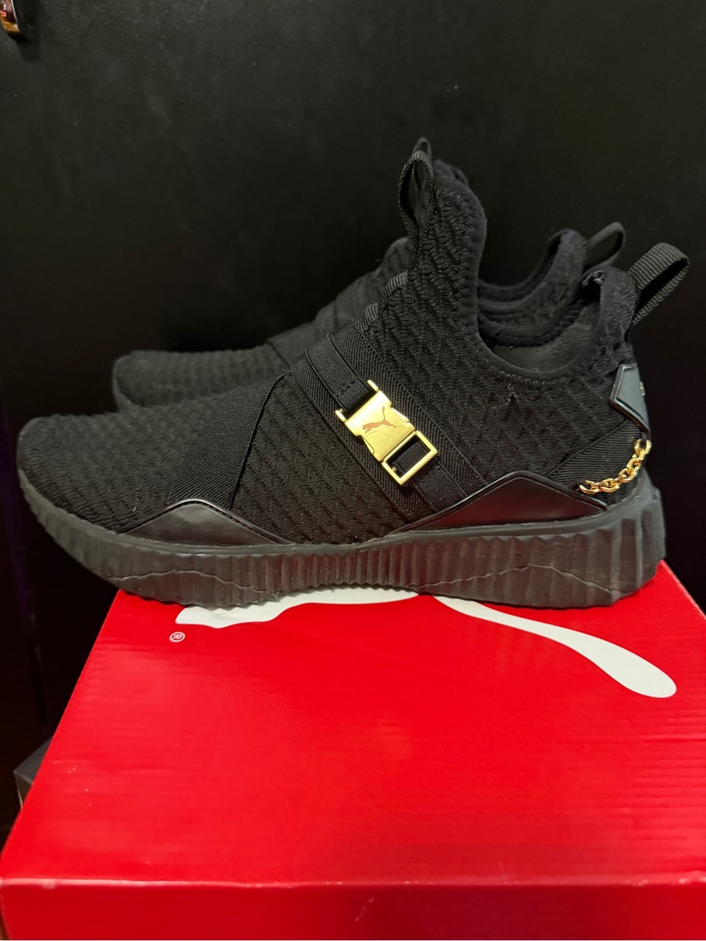 Puma Black Slip-On Knit Sneakers with Gold Hardware